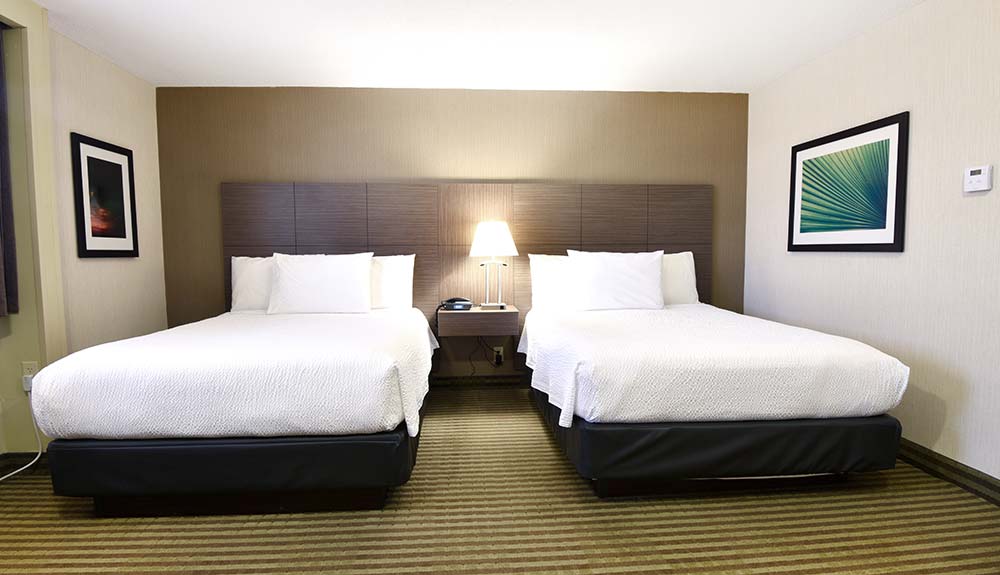 Victoria Inn Winnipeg hotel guest room with double queen beds
